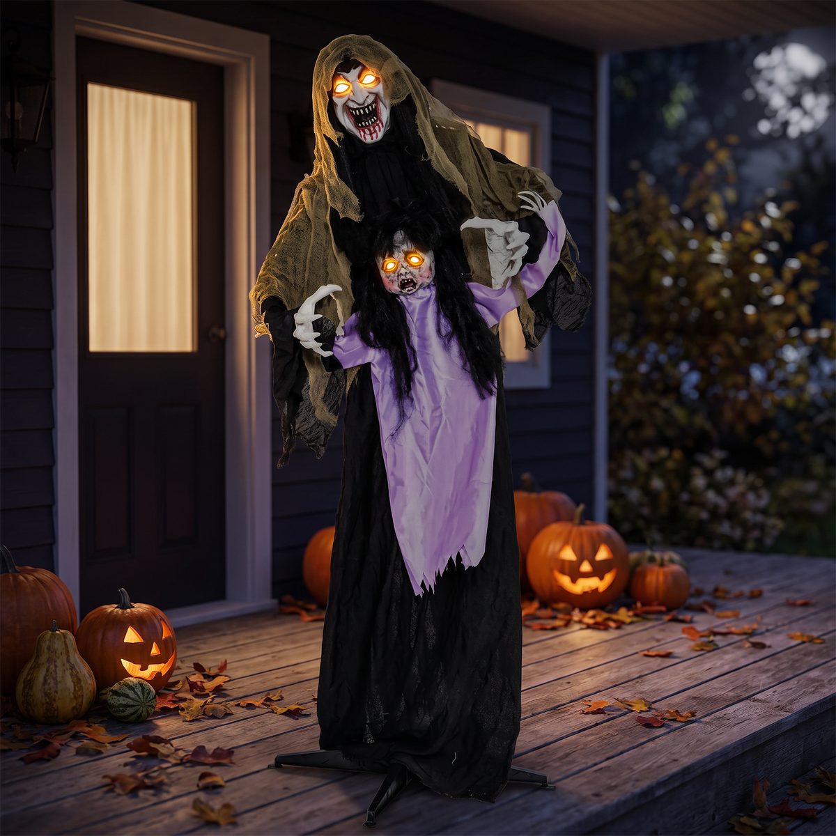 Halloween vampire decoration glowing on a front porch